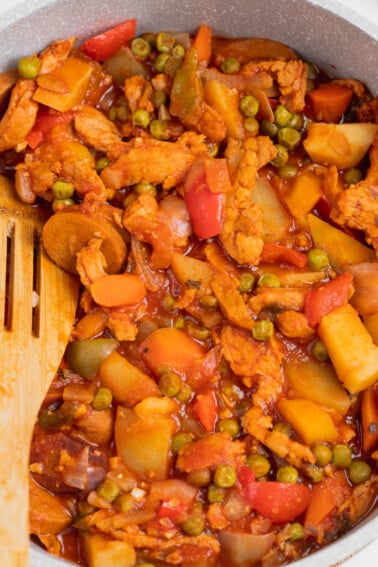 close up vegan chicken afritada in a pot, soy curls
